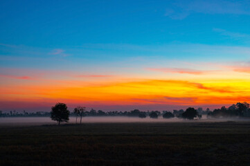 Aerial view background of sunlight , sunrise over mountain with fog over the ground in foreground savannah Meadow , Petchaboon province, Thailand,asia.Soft focus.