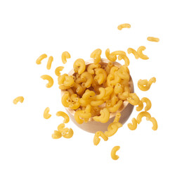 Macaroni fall on wooden bowl, yellow macaronis pasta float explode, abstract cloud fly. Curved macaroni pasta splash throwing in Air. White background Isolated high speed shutter, freeze motion
