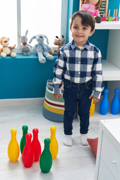 Adorable hispanic boy smiling confident standing at kindergarten