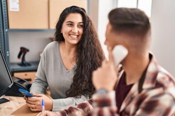 Man and woman ecommerce bussines workers working at office