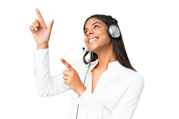 Telemarketer African American woman working with a headset over isolated chroma key background pointing with the index finger a great idea
