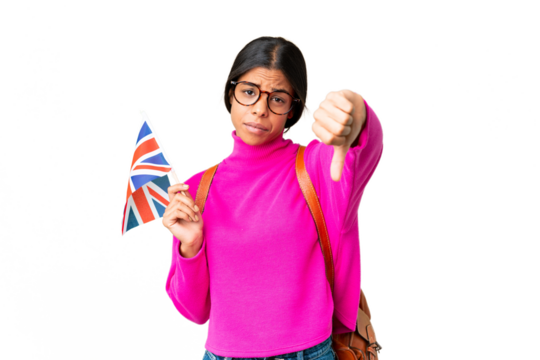 Young African American woman holding an United Kingdom flag over isolated chroma key background showing thumb down with negative expression