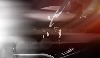 Abstract car background. The driver switches the speed in the car. Hand on gear lever.