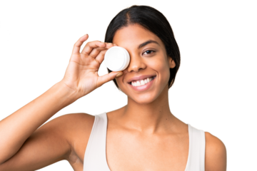 Young woman over over isolated chroma key background with moisturizer and happiness