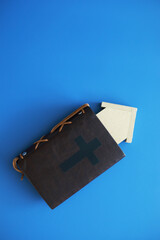 Book with the symbol of the cross. Bible study. Religious book. Prayer.