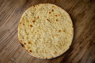 Italian bread - Focaccia, on a wooden table
