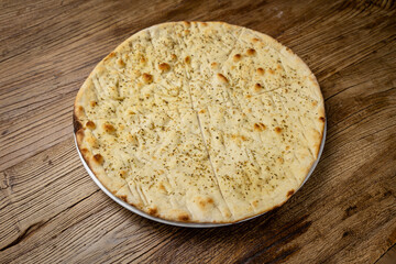 Italian bread - Focaccia, on a wooden table
