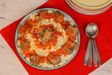 Egyptian Fettah, a traditional plate combined of rice, bread, meat and tomato sauce.  Usually cooked in the days of Eid Aladha, the Islamic Feast. 