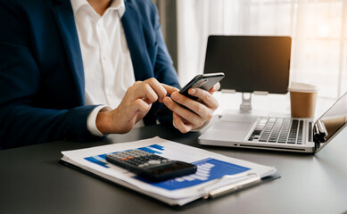 Businessman using on smartphone and tablet at home as concept