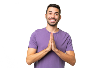Young handsome caucasian man over isolated background keeps palm together. Person asks for something