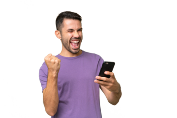 Young handsome caucasian man over isolated background with phone in victory position