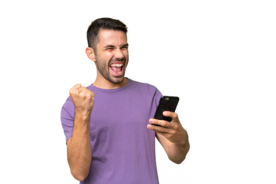 Young handsome caucasian man over isolated background with phone in victory position