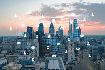 Aerial panoramic cityscape of Philadelphia financial downtown, Pennsylvania, USA. City Hall Clock Tower, sunset. Social media icons. The concept of networking and establishing people connections