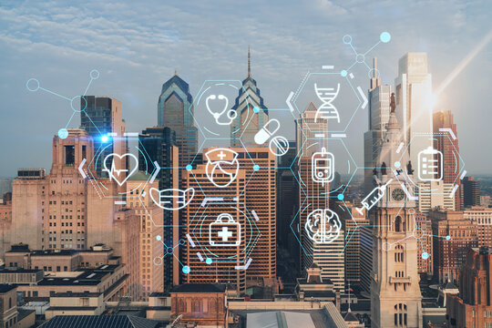 Aerial panoramic cityscape of Philadelphia financial downtown, Pennsylvania, USA. City Hall Clock Tower, sunrise. Hologram healthcare digital medicine icons. The concept of treatment from disease