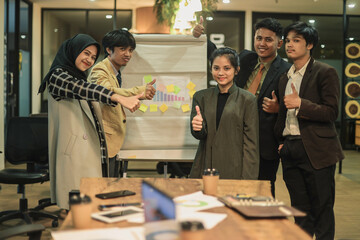 Group of business worker showing thumbs up
