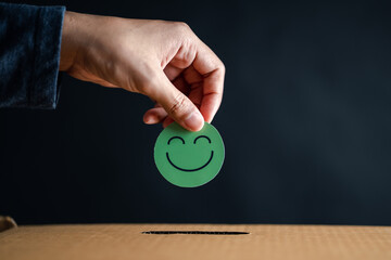 Hand giving happy smile face in comment box, user giving good feedback rating, think positive , customer review, assessment, of mental health day, Compliment Day, satisfaction concept.