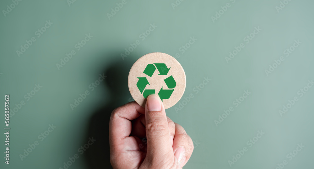 Wall mural Green Energy, Renewable and Sustainable Resources. Environmental and Ecosystem system, hand holding recycle icon paper cut on background, clean ecology concept.