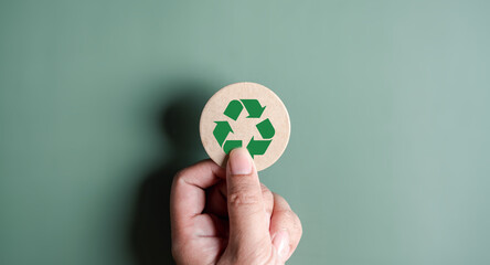 Green Energy, Renewable and Sustainable Resources. Environmental and Ecosystem system, hand holding recycle icon paper cut on background, clean ecology concept.