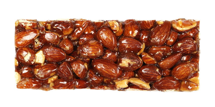 Almond caramelized nut, candied bar isolated on white, top view