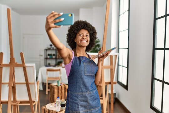 Young african american woman smiling confident make selfie by the smartphone at art studio
