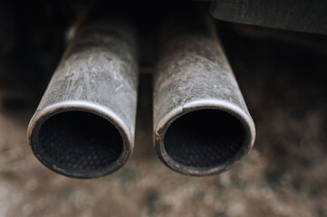 Two exhaust pipes of a sports car close-up. Photography, tuning.