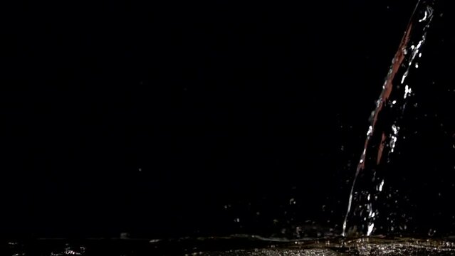 Super slow-motion shot of water splash against black. Shooted with high speed cinema camera at 1000fps