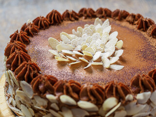 Homemade Kyiv cake or dacquoise cake with hazelnuts and almonds. Traditional Ukrainian dessert