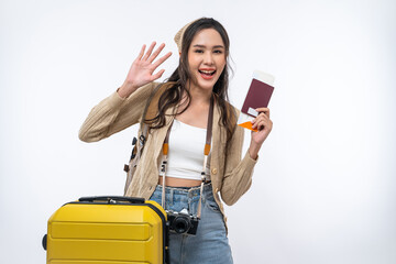 Happy Asian woman traveler with luggage, camera, passport and boarding pass ticket isolated on...