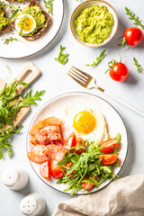 Healthy breakfast or lunch. Becon, eggs and fresh salad.
