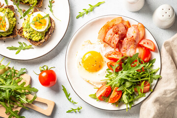 Healthy breakfast or lunch. Becon, eggs and fresh salad.