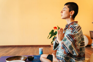 Portarait The girl is meditating Tibetan singing bowl in sound therapy