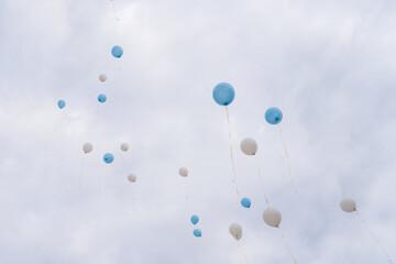 Balloons released into the sky on a festive day.