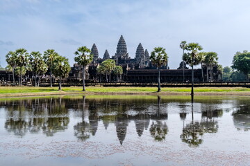 Angkor Wat main facade has a beautiful reflection on the water pond.
