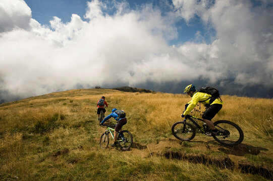 three mountain bikers on the way, Matajur, Istria, Slovenia