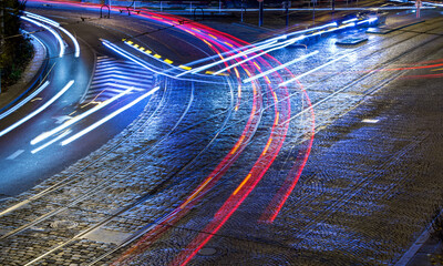 Blurred traffic on the night streets of Prague