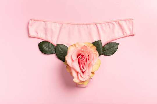 Underpants and flower on close up. Concept Keep your vagina healthy and happy. Top view Flat lay.