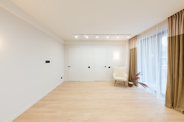 Fototapeta na wymiar stylish new Studio Kitchen with large windows and white walls