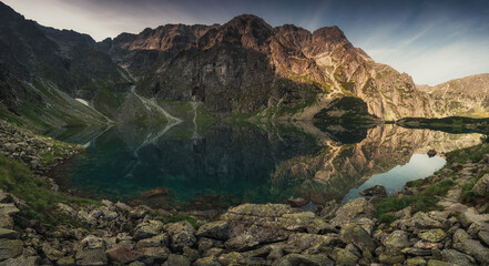 Panorama Famous Mountains Lake Morskie Oko Or Sea Eye Lake In summer time. Five Lakes Valley. Beautiful Scenic View. Tatra National Park, Poland. UNESCO's World Network of Biosphere Reserves.