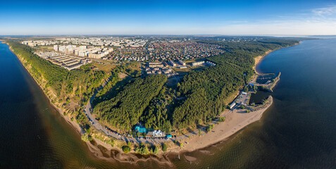 Ulyanovsk, Zavolzhsky district - coastal forest and residential development. View from the Volga river. Aerial view.