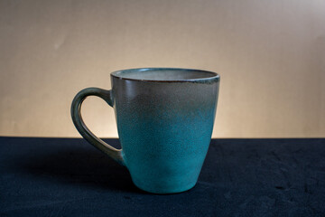 cup of coffee on the table
blue mug