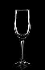 Empty glass goblet on a black background