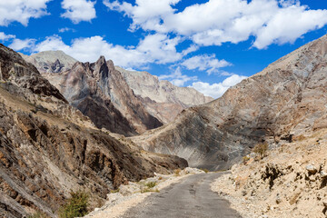 Road in Zanskar valley in India. Beautiful road in Ladakh. Moto travel in North India.