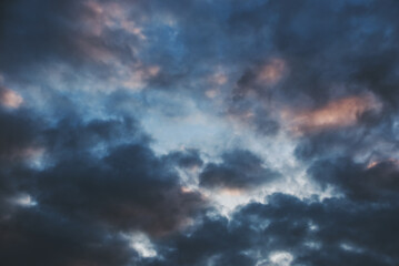 Naklejka na ściany i meble View on clouds in sunset sky