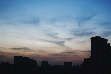 Fototapeta na wymiar Sunset sky over buildings
