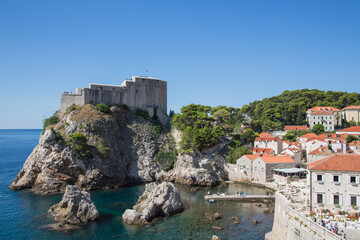 Fototapeta na wymiar Ancient Fort Livrijenac and the west harbor in the famous bay known as film location in Dubrovnik, Croatia