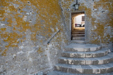 Stairway and entrance to the ancient Spanish Fortress in Hvar town, Dalmatia, Croatia with its yellow gray walls