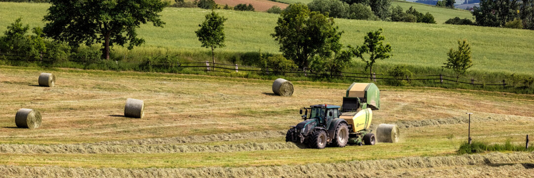 Valtra Tractor with Krone Round Baler and Trelleborg Tires, Haymaking, Lower Saxony, Germany