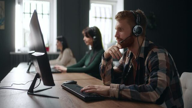 technical support service, people working in call-center, young man answering customer call, portrait