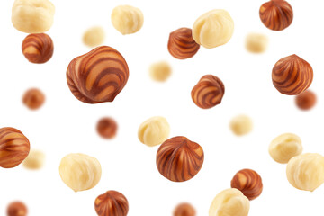 Falling Hazelnut peeled, isolated on white background, selective focus