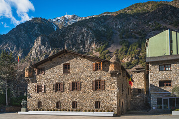 Old, 15th century, stone government heritage building, Casa de la Vall, with wooden windows and shutters in Andorra la Vella Pyrenees Mountains - obrazy, fototapety, plakaty